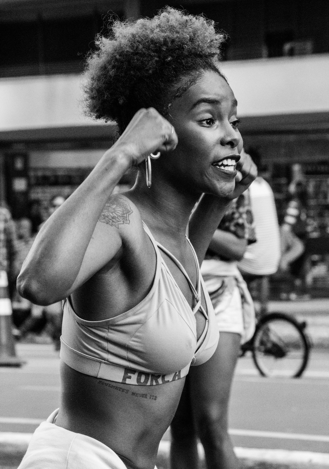 A woman taking part in an outdoor fitness activity.