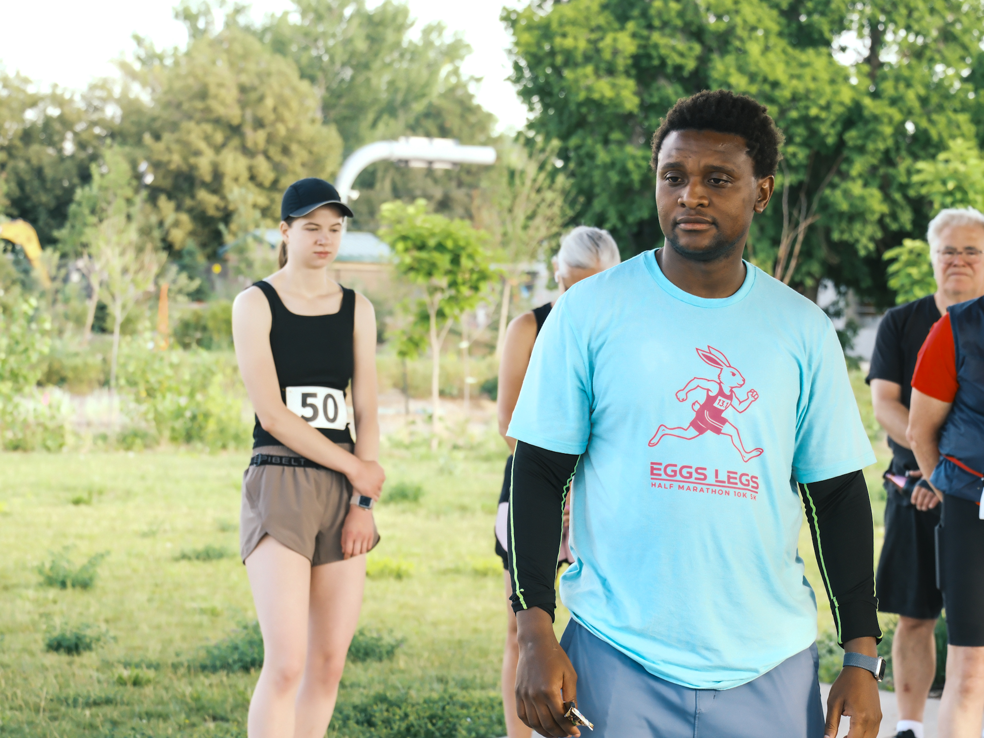 Participants gathering outdoors for the World Refugee Day 5K.